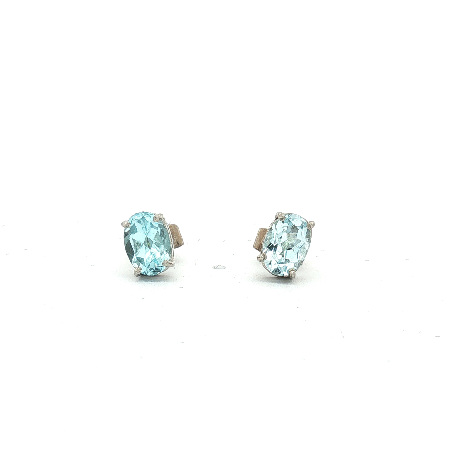 Oval Blue Topaz Stud Earrings in White Gold