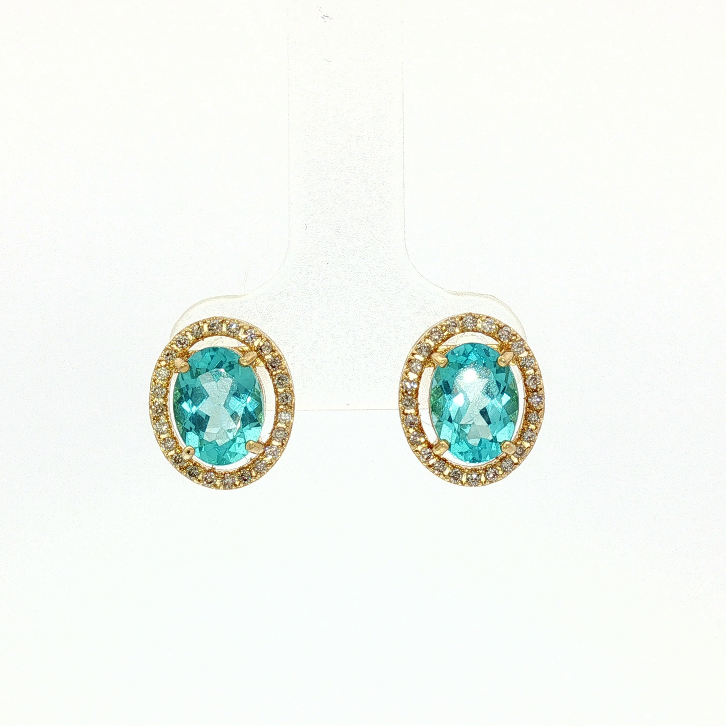 Oval Blue Topaz Halo Stud Earrings in Yellow Gold