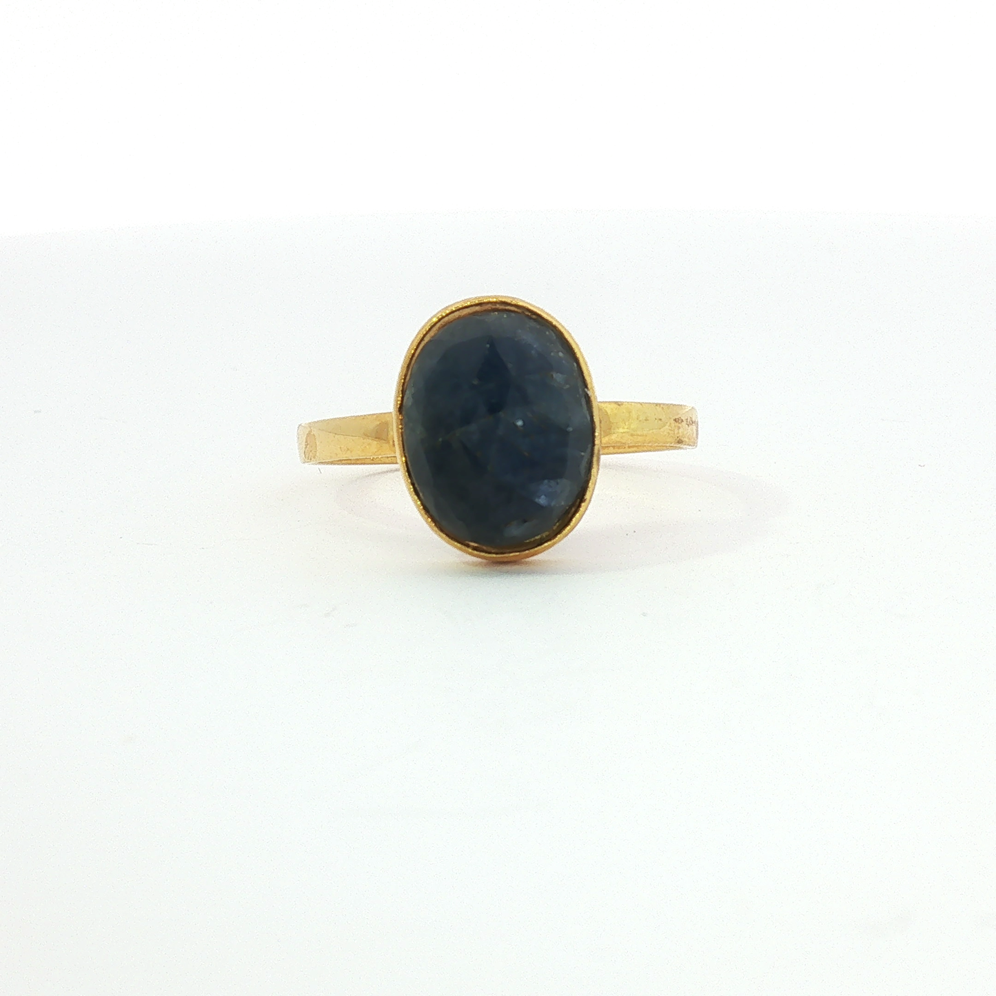 Deep Blue Sapphire Bezel Set in Yellow Gold