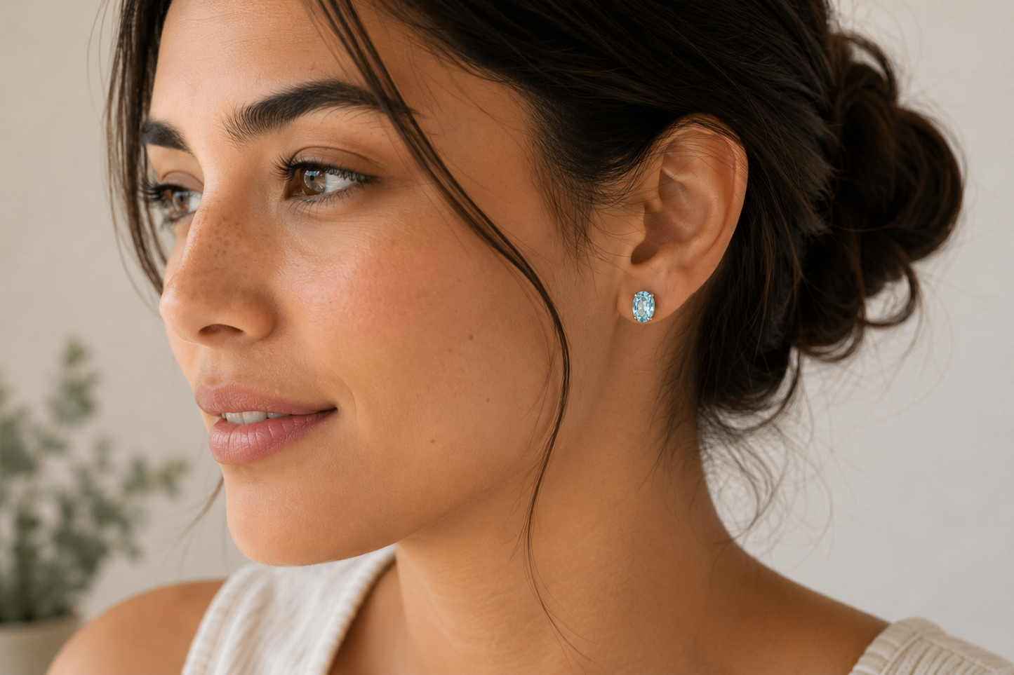 Oval Blue Topaz Stud Earrings in White Gold