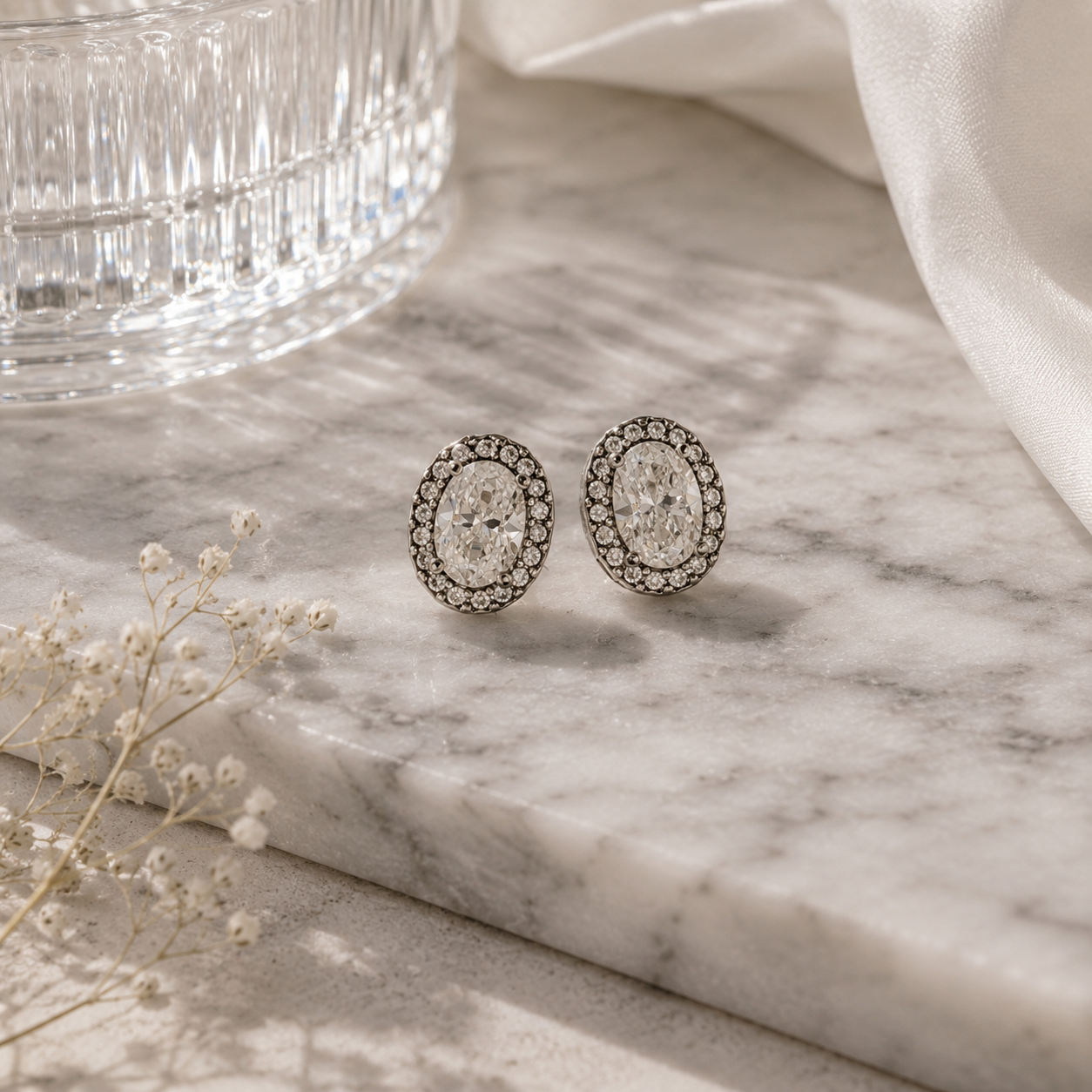 Oval Diamond Halo Stud Earrings in White Gold